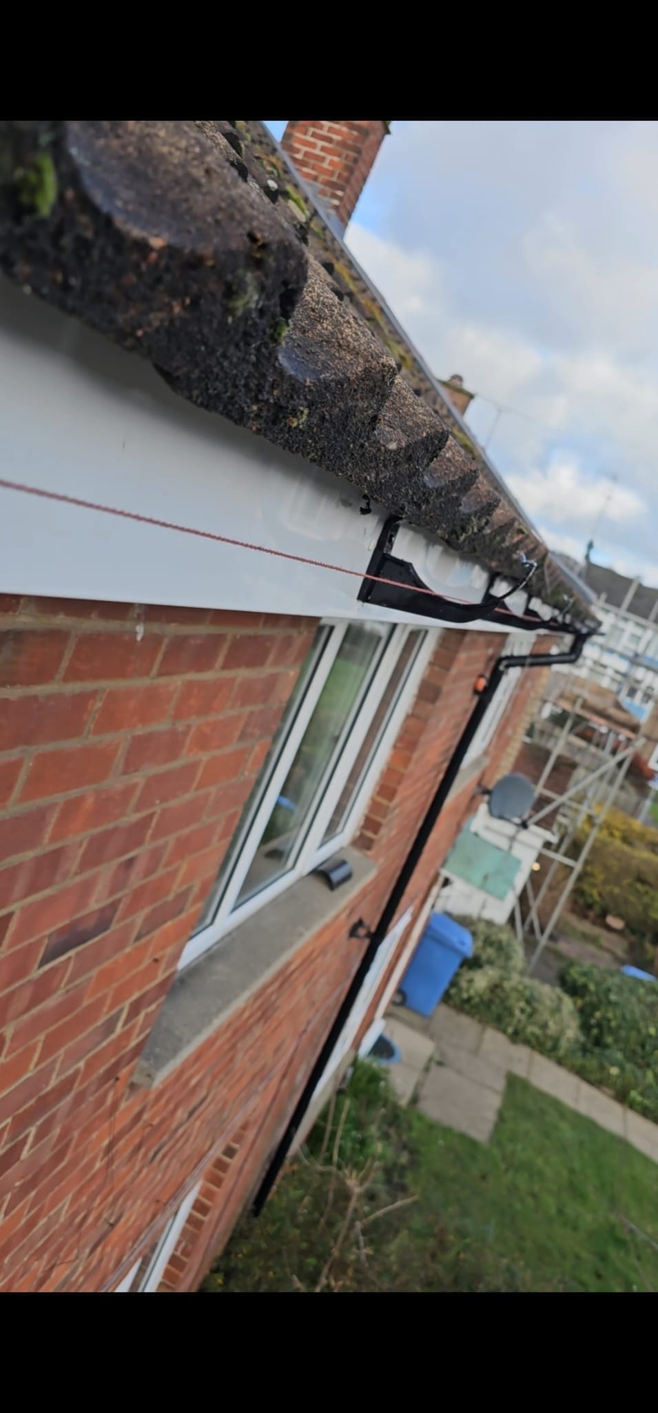 New guttering and downpipe installation in progress