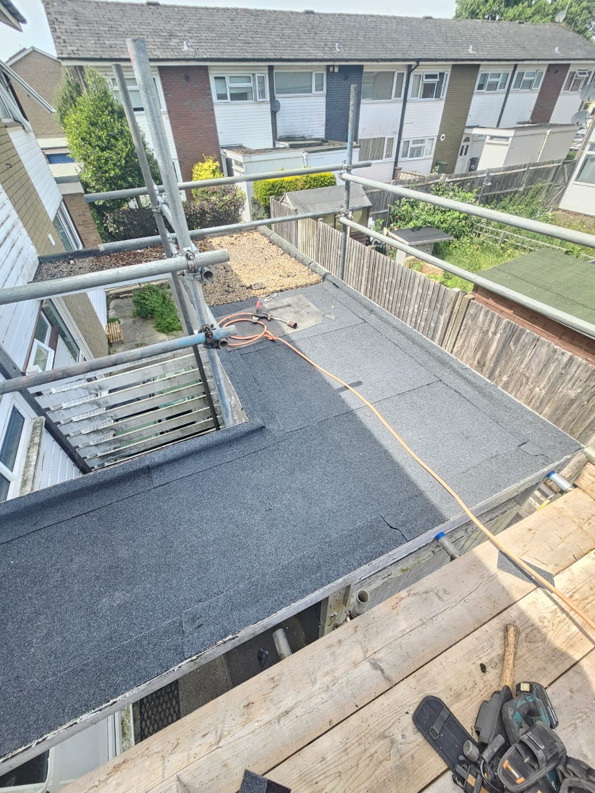 Completed torch-on flat roof viewed from scaffolding