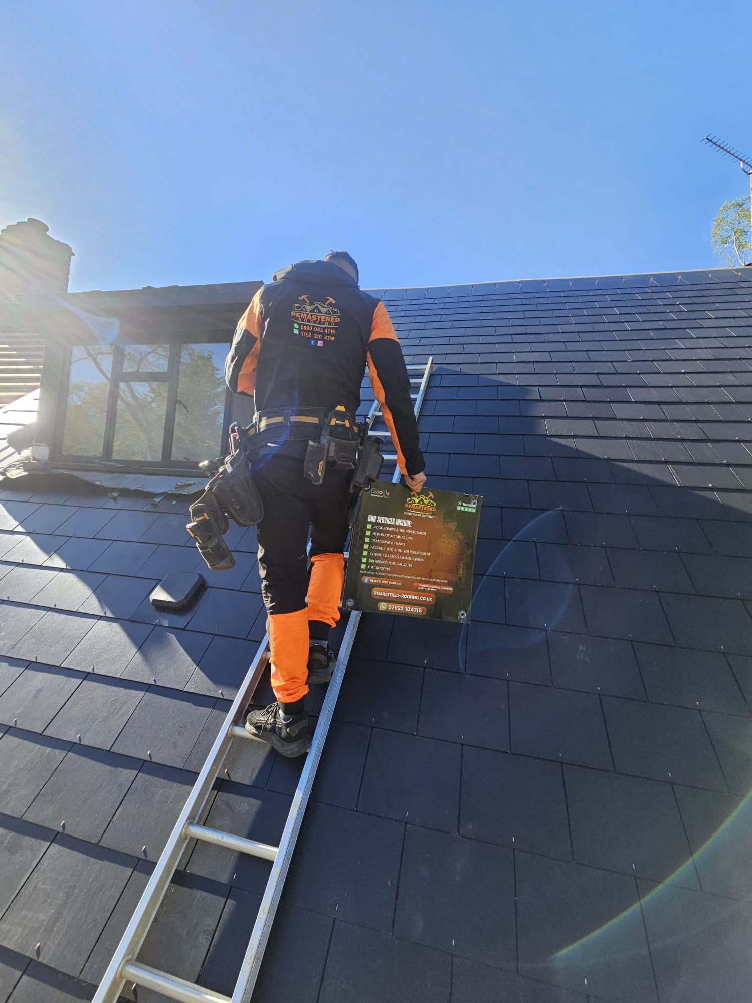 Remastered Roofing professional working on a residential roof